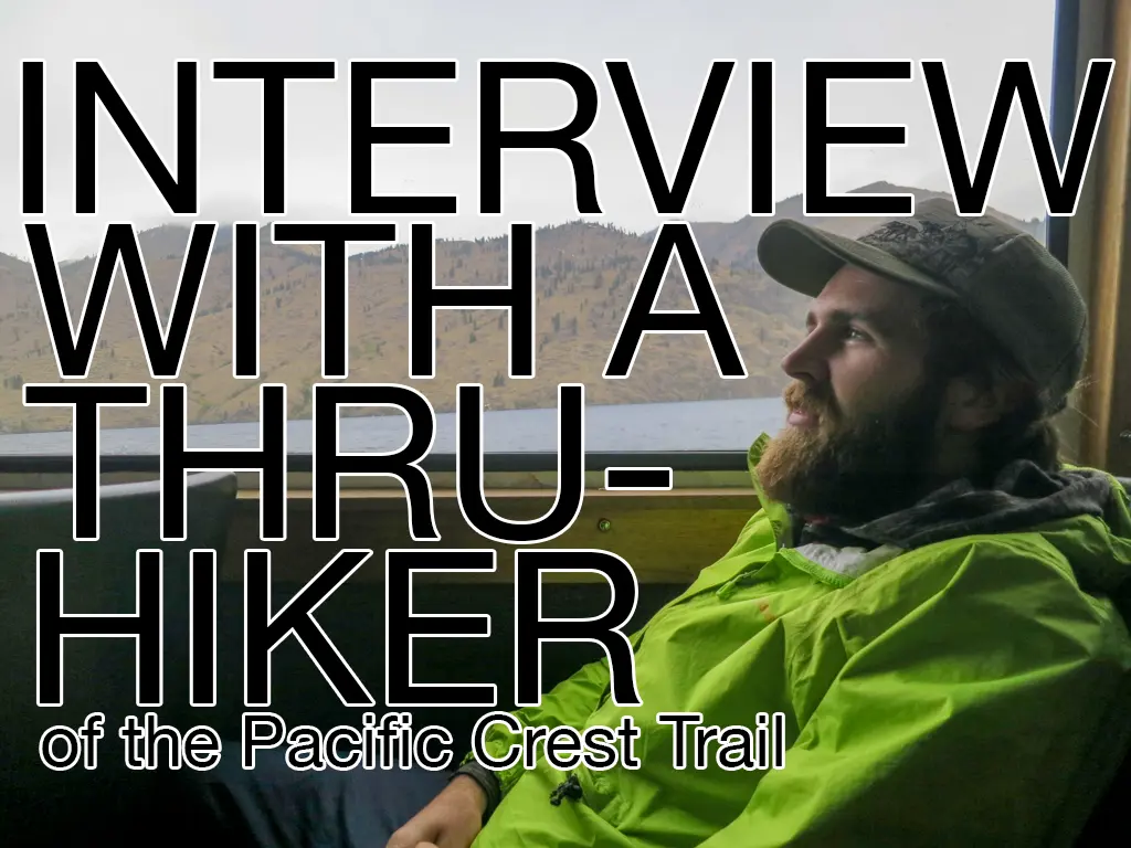 A person wearing a green jacket and cap is sitting and gazing out a window. Text overlay reads: INTERVIEW WITH APPa THE SKY BISON, THRU-HIKER of the Pacific Crest Trail. Mountains are visible in the background.