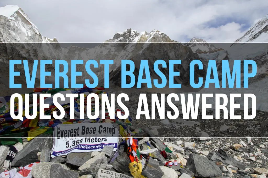 Mountains with snow and rocky terrain surround Everest Base Camp. Prayer flags flutter beside a sign reading Everest Base Camp 5,364 Meters. Text overlays the image stating, Everest Base Camp Questions Answered.