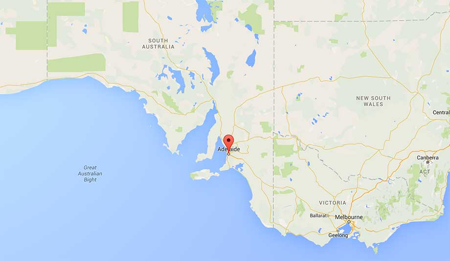 A map of southern Australia highlights Adelaide with a vivid red pin, surrounded by the regions of South Australia, Victoria, and New South Wales. To the west, the expansive Great Australian Bight is also visible.