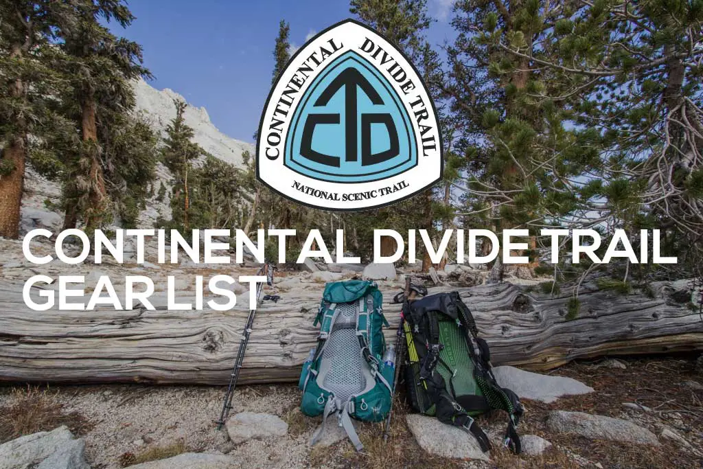 Two backpacks and trekking poles lean against a fallen log in a serene forest. Overhead, the Continental Divide Trail emblem stands proudly, accompanied by the text: Your Ultimate Continental Divide Trail Gear List.