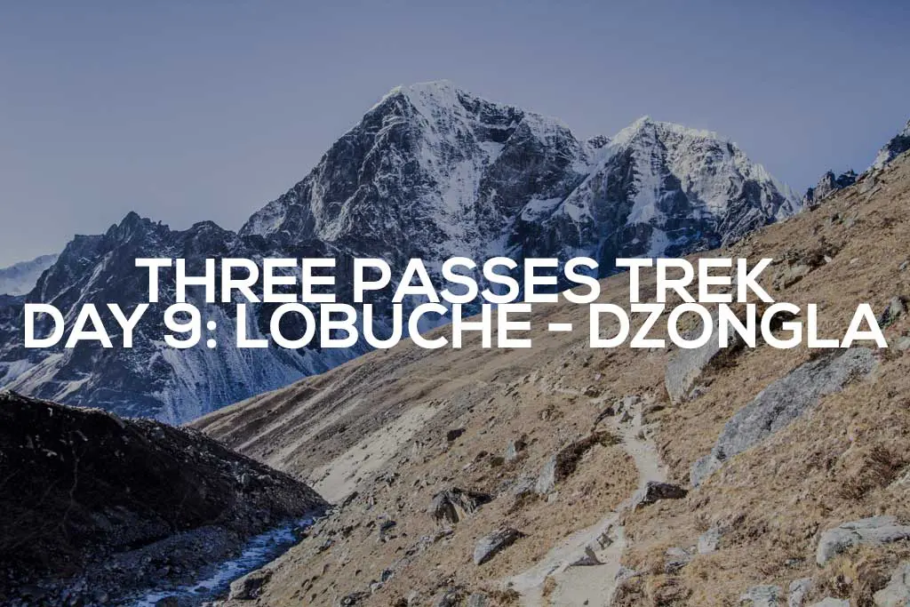 Under a clear blue sky, snow-capped mountain peaks tower majestically, while rocky terrain and brown grassy slopes stretch ahead. Text overlay reads: Three Passes Trek Day 9: Journey from Lobuche to Dzongla.