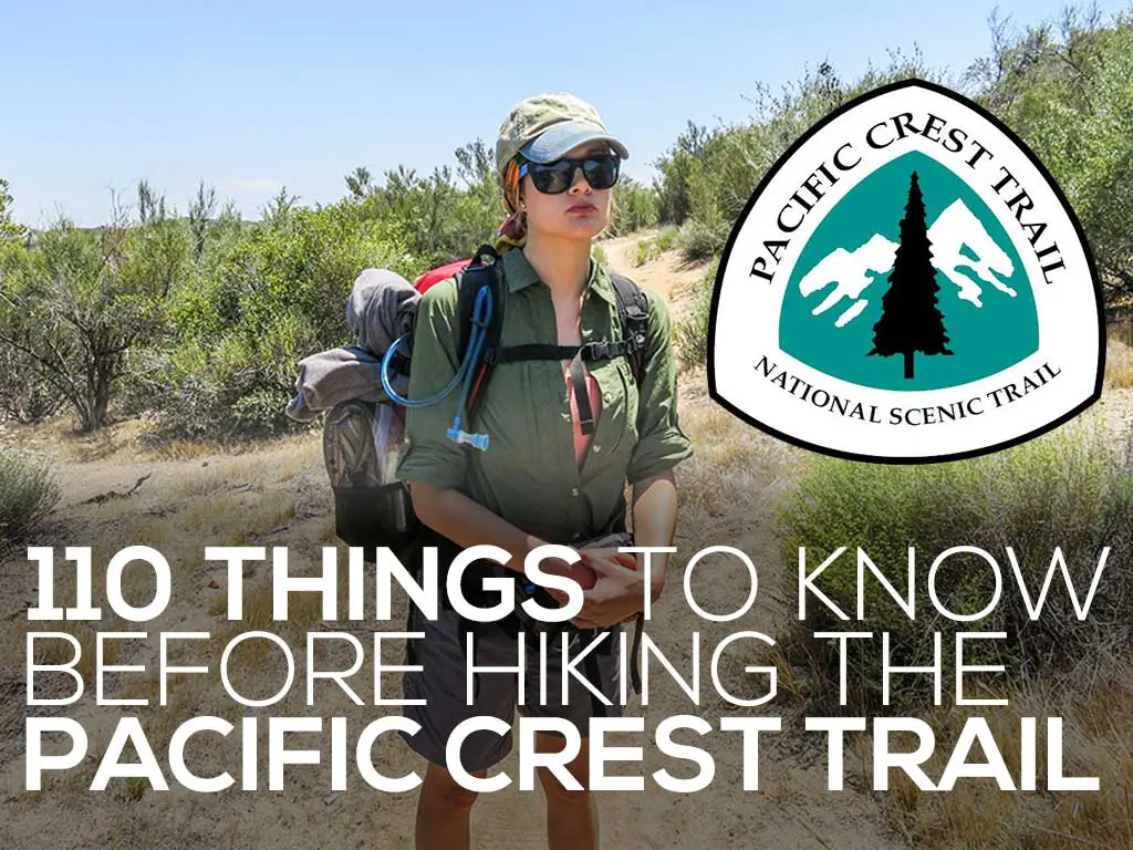A person wearing a cap, sunglasses, and a backpack stands on a sandy path flanked by bushes. The Pacific Crest Trail logo and the text Things to Know Before Hiking the PCT: 110 Essentials are prominently displayed.