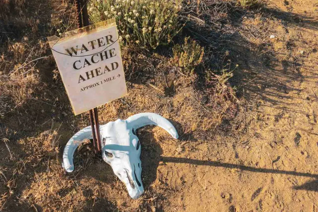 Water cache ahead sign