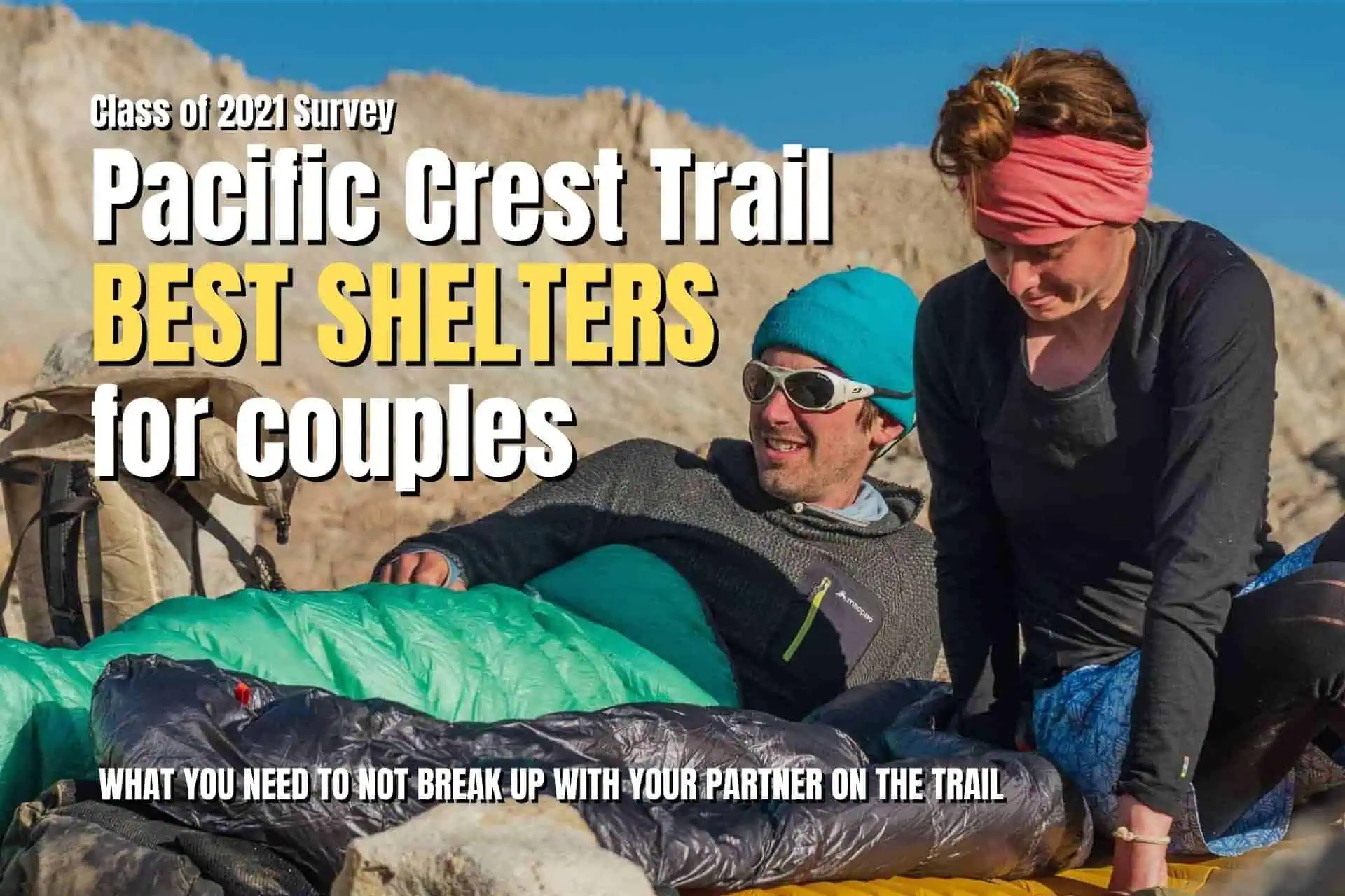 A couple enjoys the rugged outdoors on a rocky landscape. The man lounges in a sleeping bag, donning sunglasses and a hat, while the woman, sporting a headband and jacket, sits beside him. Text reads: Pacific Crest Trail: Best Couples Shelters.