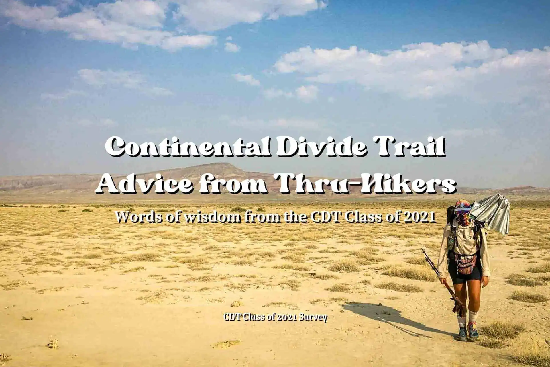 A hiker strolls through a sprawling desert expanse under a blue sky dotted with clouds. Text overlay reads, CDT Advice 2021 - Words of wisdom from the Continental Divide Trail Class of 2021.