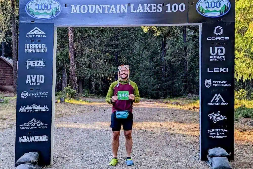 Mac standing at the starting line of the Mountain Lakes 100