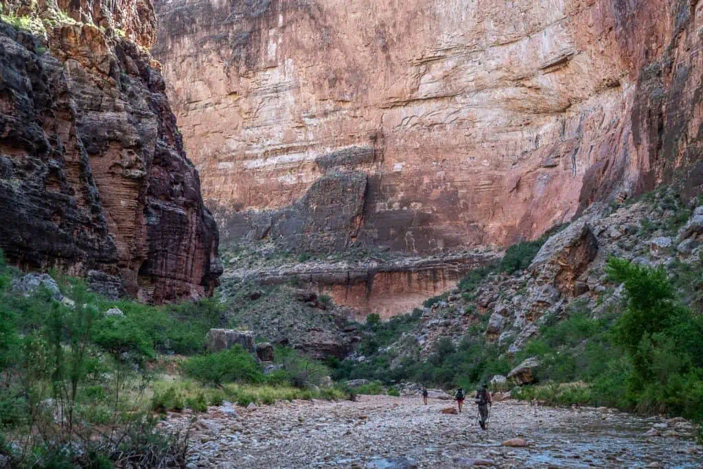 a group of hikers hiking up kanab canyon