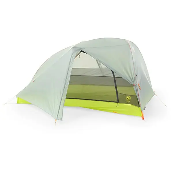 A light green camping tent with a rainfly is pitched, featuring a mesh inner lining for ventilation. This JMT Gear Guide 2024 favorite boasts a neon green floor and orange guy lines for stability, comfortably accommodating two or more adventurers.