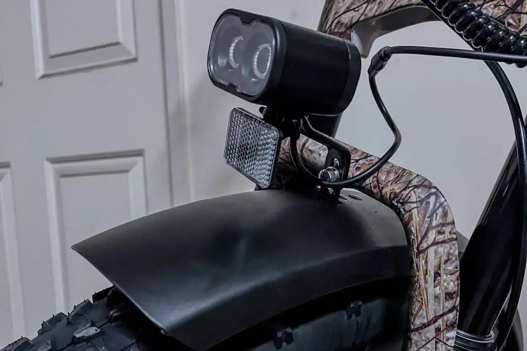A close up of a motorcycle with a light on it