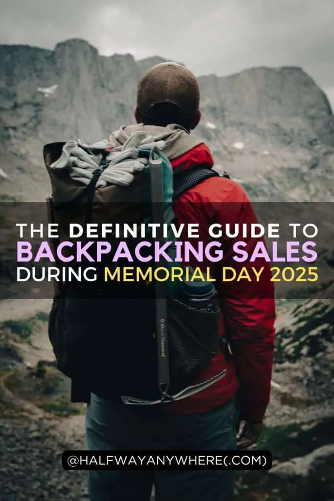 A person wearing a red jacket and backpack stands facing rocky mountains. Overlaid text reads: The ultimate Memorial Day sales guide for backpackers, 2025. At the bottom is the handle @halfwayanywhere(dot)com.